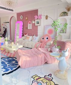 a living room filled with lots of furniture and pink accents on the walls, along with an animal shaped couch