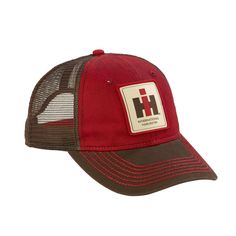 This IH Logo cap is made 100% cotton chino twill with polyester trucker mesh sides and back. The IH is made to look like weathered, worn washed and dirty. The IH logo is a woven patch on the front of the cap. The cap is a low-profile, unstructured with a curved bill and contrast stitching. The cap has a plastic snap closure. One size fits most adults. Red Cotton Trucker Baseball Cap, Outdoor Red Hats With Logo Patch, Red Cotton Trucker Hat, Brown Cotton Trucker Hat, Red Six-panel Trucker Hat For Outdoor, Red Trucker Hat For Outdoor, Cotton Trucker Hat With Logo Patch, Red Cotton Baseball Cap For Outdoor, Red Cotton Outdoor Baseball Cap