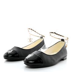 This is an authentic pair of CHANEL Lambskin Patent Calfskin Cap Toe Ankle Chain Ballerina Flats size 37 in Black. These classic flats are crafted of black lambskin leather. The flats feature black patent cap toe, leather and chain braided cross over strap, and a dangling gold camellia charm. Chain Braid, Ankle Chain, Ballerina Flats, Lambskin Leather, Calf Skin, Chanel, Chain, Leather, Gold