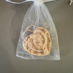 a cookie in a clear plastic bag on a table