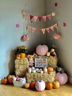 a display with hay bales and pumpkins