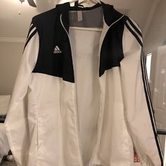 Black And White Adidas Wind Breaker. Never Worn. White Adidas Windbreaker For Spring, Adidas White Track Jacket For Fall, Adidas White Outerwear For Spring, Adidas Casual White Track Jacket, White Adidas Outerwear For Spring, Casual White Adidas Track Jacket, White Adidas Windbreaker For Fall, Adidas White Windbreaker For Fall, Adidas White Outerwear For Fall