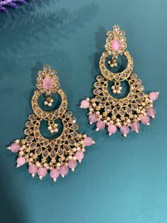 High quality polki earring. About 2 inch long and 2inch wide. Kundan Chandbali Bridal Earrings, Metal Chandbali Chandelier Earrings, Kundan Hand Set Chandelier Earrings, Hand Set Kundan Chandelier Dangle Earrings, Pink Dangle Kundan Earrings, Heavy Chandbali Chandelier Earrings In Metal, Bollywood Kundan Bridal Earrings For Pierced Ears, Bollywood Style Metal Earrings With Stone Work, Bollywood Bridal Kundan Earrings For Pierced Ears