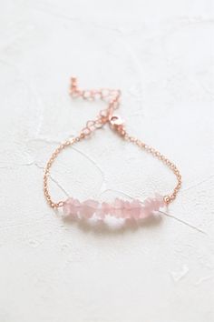 Rose quartz bracelet in rose gold plated. Gemstone size: about 15mm Metal component: 18k gold plated with brass base Bracelet length: 6 inches with 2 inches extender The price is for one bracelet. ﹎﹎﹎﹎﹎﹎﹎﹎﹎﹎﹎﹎﹎﹎﹎﹎﹎﹎﹎﹎﹎﹎ Please kindly understand that every crystal is natural and they are not perfect, but they are both gorgeous. I will send the crystal to you randomly. It may not exactly the same with the one in pictures but they are comparable in size, color and quality. If you have any request, Dainty Rose Quartz Jewelry In Rose Gold, Dainty Rose Gold Beaded Bracelets With Rose Quartz, Minimalist Rose Gold Bracelet For Bridesmaid Gift, Rose Gold Rose Quartz Crystal Bracelet For Gift, Elegant Rose Quartz Crystal Bracelet, Elegant Rose Gold Crystal Bracelet With Rose Quartz, Minimalist Rose Gold Crystal Bracelet For Gift, Delicate Rose Gold Bracelets For Bridesmaids, Minimalist Rose Gold Crystal Bracelet Gift