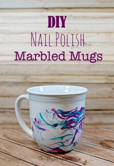 a coffee cup with the words diy nail polish marbled mugs on it