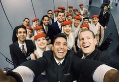 a group of people with red hats on their heads