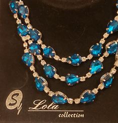 My aunts Rhinestone Necklace comes to you from the 50's. It comes from Lola Collections. 3 layers of blue and white rhinestones . The shortest strand is 16 inches and the 3rd is 18. All with an extention chain. This is a great piece to add to anyone's collection! Sapphire Rhinestone Party Necklace, Luxury Blue Victorian Necklaces, Luxury Multi-stone Blue Jewelry, Elegant Multi-stone Blue Necklaces, Jade Mala, Luxury Blue Multi-stone Necklaces, Buddhist Beads, Beaded Tassel Necklace, Tassel Bracelet