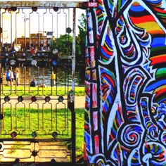 an iron gate with colorful designs on it