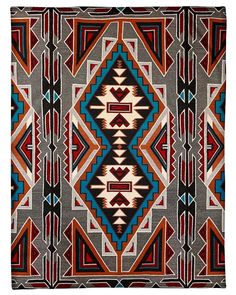 an old navajo rug with colorful designs on it's sides and red, blue, black