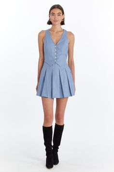 Meet the Niall Skort Romper—a chic blend of classic and contemporary. This vest-top skort romper features a pleated skirt layered over self-fabric shorts, creating the illusion of a stylish two-piece outfit. With five buttons down the center front and an invisible zipper at the wearer's left side seam, it offers a seamless look and easy wear. The Niall Skort Romper is perfect for making a refined statement with a playful twist. Style Details: Vest Top Skort Romper Pleated Skirt Self Fabric Short Blue Fitted Pleated Skort, Blue Skort With Button Closure, Playful Fitted Blue Bubble Romper, Short Blue Romper, Blue Playsuit, Skort Romper, Twist Style, Exclusive Dress, Maxi Gowns