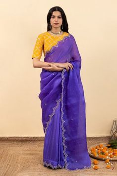 Royal purple half and half cutwork saree with bead, thread placement embroidery in floral pattern. Paired with mango yellow chokor print blouse.
Components: 2
Pattern: Embroidery
Type Of Work: Bead, thread, floral
Neckline: Round
Sleeve Type: Half
Fabric: Satin Silk Organza, Soft Silk, Raw Silk
Color: Purple
Other Details: 
Cutwork border
Back keyhole
Occasion: Wedding - Aza Fashions Cutwork Saree, Placement Embroidery, Mango Yellow, Organza Embroidery, Purple Saree, Yellow Saree, Embroidered Saree, Elegant Blouse Designs, Blue Saree