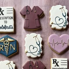 decorated cookies with medical symbols and stethoscopes are arranged on a table