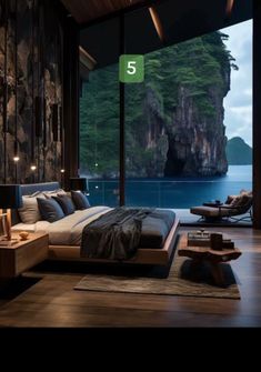 a bedroom with an ocean view and wooden flooring