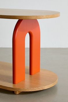 an orange object on a wooden stand