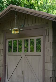 an image of a garage with the door open and light hanging from it's side