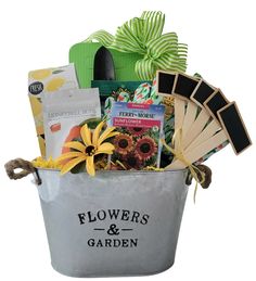 a bucket filled with flowers and gardening items