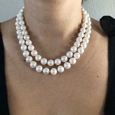 Freshwater Two Strand White Bridal Pearl Necklace. This beautiful necklace is the epitome of class. Two strands hand strung and individually knotted. The shorter strand is 17 inches and the longer strand is 18 inches. Quality pearl necklaces are always knotted between the pearls. This protects the pearls from rubbing together and becoming damaged. All pearls are natural and genuine. PEARL SIZE: 10.5mm - 11.5mm PEARL SHAPE: Round PEARL COLOR: Pearlescent white, a very natural pearl color NECKLACE Elegant Hand-strung Jewelry For Anniversary, Double Strand Akoya Pearl Necklace, Elegant Hand Knotted Silver Jewelry, Anniversary Pearl White Double Strand Necklace, Formal White Hand-strung Jewelry, Elegant Hand-strung Double Strand Necklaces, Elegant Hand-knotted Silver Jewelry, Elegant Silver Hand Knotted Necklace, Formal Bridal Necklace With Round Beads