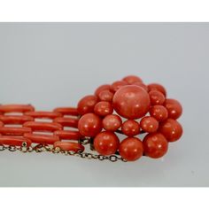 This is part of Chairish’s Costume Jewelry assortment.  Vintage circa 1950 Coral Flower Bracelet  This vintage Coral Flower Bracelet comes out of Italy and is in gorgeous condition. The bracelet is 6 1/2" long the flower Head is 2 1/4" round with ten (10) round beads circling around the Flower head and nine (9) beads centering the large Coral Stone. The bracelet is made out of Coral bars, 4 then 3 then 4 alternating. 15 cm in length 4 cm in width. 37.6 grams. Most people do not know Coral especi Vintage Polished Beads Bracelet Jewelry, Vintage Polished Beads Bracelet, Vintage Polished Bead Bracelet, Vintage Red Coral Jewelry With Polished Beads, Hand-strung Coral Bracelets With Round Beads, Vintage Coral Round Bead Jewelry, Adjustable Hand-strung Coral Bracelets, Elegant Multi-strand Red Coral Jewelry, Coral Flowers