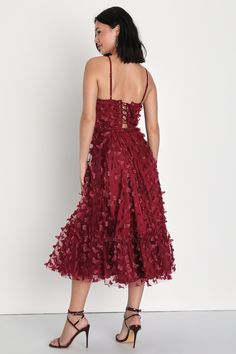 Soar toward any celebration in style with the Lulus Time to Fly Burgundy Butterfly Lace-Up Midi Dress! Eye-catching three-dimensional butterfly appliques decorate sheer mesh as it shapes a bustier-style bodice with a sweetheart neckline and seamed cups, all supported by adjustable spaghetti straps. Long laces thread through silver aglets at back. High waist tops the flaring midi skirt, with a tulle-enforced tier at the hem. Hidden back zipper/clasp at back. Fit: This garment fits true to size. L Summer Party Midi Dress With Floral Applique, Party Dress With Sweetheart Neckline And Floral Appliqué, Sleeveless Midi Dress With Floral Applique For Party, Prom Midi Dress With Lace-up Back, Elegant Midi Dress With Lace-up Strappy Back, Fitted Floral Applique Midi Dress For Party, Elegant Party Dresses With Butterfly Print, Butterfly Shape Tulle Dress For Party, Elegant Fitted Dresses With Butterfly Print