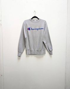 "a vintage grey champion sweatshirt ✿ IMPORTANT INFORMATION: * excellent vintage condition  * material: 77% cotton + 23% polyester * size: small - please check exact measurements below (they're there for your benefit!) * garment care: machine washable ✿ MEASUREMENTS (taken while item is lying flat, some measurements will need to be doubled): * shoulder to shoulder: 17.5\" (44cm) * armpit to armpit: 20\" (51cm) * length (centre of back neckline to bottom): 26.5\" (67cm) * sleeves (shoulder to cuff): 24.5\" (62cm) ✿ free UK shipping on orders over £100 with code STRAWBERRY free international shipping on orders over £250 with code LEMON ✿ please refer to measurements and shop policies before purchasing don't hesitate to get in contact if you have any further questions! follow us on instagram Vintage Gray Tops With Ribbed Cuffs, Gray Cotton Sporty Sweatshirt, Sporty Gray Cotton Sweatshirt, Gray Cotton Sweatshirt With Logo Print, Gray Cotton Sweater With Logo Print, Gray Cotton Sports Sweatshirt, Vintage Gray Sweater For Streetwear, Gray Long Sleeve Sweatshirt With Logo Print, Vintage Gray Crew Neck Sweatshirt