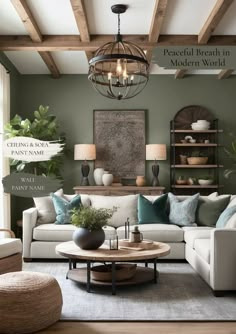 a living room with green walls and white couches, coffee table, potted plants