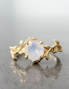 This leaf moonstone ring is intricately designed in 14k gold plating over sterling silver. It is a very unique piece just like the person wearing it! Moonstone is considered to be a stone of "New Beginnings". It can help you stabilize your emotions and enhance your intuition. Oval Stackable Jewelry For Promise, 14k Gold Jewelry With Stone Setting For Anniversary, Yellow Gold Ring With Stone Setting, Vintage Moonstone Ring Jewelry, Handmade Elegant Moonstone Stackable Rings, Elegant Handmade Moonstone Stackable Rings, Elegant Handmade Stackable Moonstone Rings, Adjustable Open Emerald Ring For Wedding, Elegant Adjustable Moonstone Stackable Rings