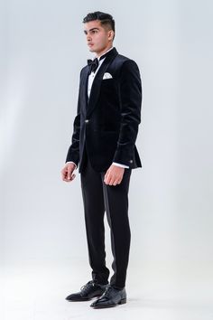 Black velvet tuxedo with shawl lapel collared neckline. Paired with white shirt, trouser, bow and waist band.
Components: 5
Type Of Work: Plain
Neckline: Shawl lapel collar
Sleeve Type: Full sleeves
Fabric: Velvet
Color: Black
Other Details: 
Front button detailing
Cuff sleeve hem
Note: Pocket square worn by the model is not for sale
Occasion: Cocktail and Reception - Aza Fashions Black Velvet Tuxedo, Velvet Tuxedo, Shirt Trouser, Velvet Shawl, Velvet Color, Full Sleeves, Lapel Collar, Cuff Sleeves, Waist Band