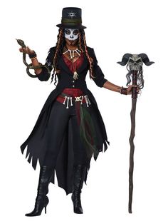 a woman dressed up as a skeleton with a hat and long black hair holding a cane