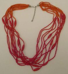 Never worn vintage multi-colored orange multi 10 strands round glass seed beads and marbled squared oval lucite plastic beaded necklace with silver tone end cap findings, silver-tone metal extension chain, and lobster claw clasp.  Necklace length 25 & 1/2 inches, Extension Chain: 2 & 3/8 inches. I offer discounted combined shipping charges. Plastic Beads, Multi Strand Necklace, Strand Necklace, Glass Necklace, Multi Strand, Orange Color, Seed Beads, Silver Tone, Necklace Lengths