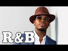 a man wearing a hat and sunglasses with the words r & b on it in front of him