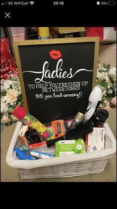 a basket filled with personal care items next to a sign that says ladies to help you freshen up