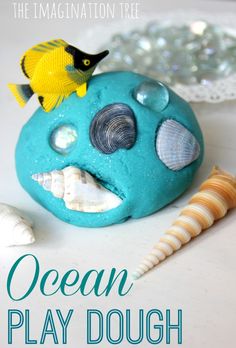 the ocean play dough is made with sea shells and seashells to look like a fish