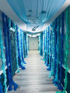 the hallway is decorated with blue and green streamers