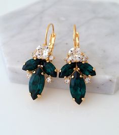 "✤ I can make these earrings with many other colors to match your wedding party scheme (or any other occasion). Please just contact me. ✤ Matching bracelets are available here: https://etsy.me/2WMaKVD ✤ Matching necklace is available here: https://etsy.me/33jYcYj ✤ Available also in silver plating, yellow gold plating. Just choose at \"Metal type\" box. ✤ Made with CRYSTALLIZED™ - Swarovski crystals. ✤ Drop/lever back Earrings. Clip-on earrings are available upon request. ✤ Size approx - 25mm x Green And Gold Earrings, Unique Wedding Earrings, Drop Gold Earrings, Emerald Drop Earrings, Blue Bridal Earrings, Bridal Drop Earrings, Bridal Earrings Studs, Emerald Earrings Drop, White Opal Earrings