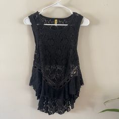 Free People Dark Bloom Ruffle Open Back Lace Tank In Black Size: Xs Sleeveless Open Back Pullover Flaws: No Holes, Tears Or Stains Material/Care Tags Are Pictured Special Notes: Color May Vary Between Devices Used And Lighting. No Size Is The Same From Brand To Brand. Most Items Are Washed And/Or Streamed Before Packaged For Storage Smoke Free Home. Packaged With Care And Shipped Right Away Black Lace Tops With Ruffles, Bohemian Black Tops With Ruffles, Black Ruffled Summer Top, Black Lace Trim Tank Top For Summer, Black Lace Tank Top For Summer, Casual Black Lace Trim Tank Top, Casual Black Tank Top With Lace Trim, Black Ruffled Tank Top For Summer, Black Bohemian Tank Top For Summer