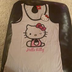 Reposhing This Item I Purchased From @02171980. Loved It, But Ready To Rotate For Something New. Questions? Leave A Comment Below! Hello Kitty On Fire, Y2k Sleeveless Top With Hello Kitty Print, Sanrio Clothes, Y2k Hello Kitty, Cat Tanks, Small Tank Tops, Kitty Clothes, Hello Kitty Clothes, Future Clothes