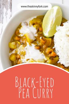 black - eyed pea curry in a white bowl with rice and a lime slice on the side