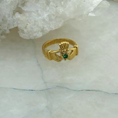 14K Yellow Gold Claddagh Ring with Emerald, Ring size 6.5, 4.7 grams Stock # BRT04-R37 This listing contains photographs of the actual item you will receive. Our items are in excellent condition with little or no signs of wear and many are one of a kind pre-owned estate finds. Please look closely at the pictures in this listing as they are part of the product description. Please read the description, as any imperfections or condition comments will be included. We do our best to accurately descri Emerald Claddagh Ring, Gold Signet Ring With May Birthstone, Collectible Yellow Gold Birthstone Rings, Yellow Gold Rings With Birthstone, Yellow Gold May Birthstone Collectible Ring, Gold Hallmarked Ring For May Birthstone, Collectible May Birthstone Yellow Gold Ring, Collectible Yellow Gold May Birthstone Ring, Yellow Gold Jewelry Collectible For May Birthstone