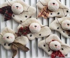 four snowman ornaments are hanging on the radiator