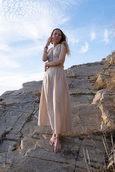 Linen/cotton dress with drawstring in beige colour. Soft and light fabric with rustic texture. Perfectly fitting sizes from S to M. Open back makes it a best dress for warm summer days and nights. It is a statement dress for a special occasion but enough comfortable for everyday use too. The dress size is adjustable by strings on the back, under the bust and on the waistline with 2 elastic bands on the sides. Will look nicely on both small and big busts. Dress has a double layer of fabric on a t Bohemian Ramie Maxi Dress, Cream Linen Dress For The Beach, Bohemian Linen Midi Dress For Vacation, Bohemian Linen Dress In Natural Color, Beige Linen V-neck Maxi Dress, Beige Linen Vacation Dress, Bohemian Linen V-neck Midi Dress, Bohemian Linen Maxi Dress, Bohemian Linen Dress