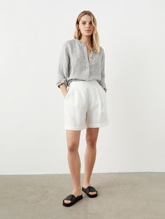 "Elegant yet comfy linen bermuda shorts with subtle pleats. Perfect for everyday wear. Offered in medium-weight linen. If you're interested in heavy-weight option, you'll find another WALK listing in our PANTS & SHORTS section. STYLE DETAILS * Regular fit * High waist * 2 soft pleats  * Side zipper * Elasticated back * 2 inside pockets * Made from medium-weight linen SIZES & COLORS IN THE PICTURES * Model's wearing size S in Off White (medium) linen. Model's height - 176 cm (5'9\"), bust - 83 cm (32.7\"), waist - 60 cm (23.6\"), hips - 89 cm (35\").  CUSTOMIZATION * Customization is possible, but such items are non-changeable & non-refundable * There is extra charge depending on the particular customization * If you want a customization, message us with your measurements and specific reque Shorts For Big Legs, Linen Bermuda Shorts Outfit, Longer Shorts Outfits Women, White Bermuda Shorts Outfit, Bermuda Shorts Outfit Women, White Linen Shorts Outfit, Trouser Shorts Outfit, Pleated Shorts Outfit, Shorts Photoshoot