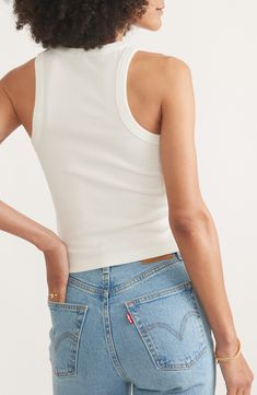 Sure to be a go-to for hot days, this fitted, cropped tank is made from stretchy ribbed fabric that's garment-dyed for a sun-faded look. Crewneck Sleeveless, with cutaway shoulders 49% cotton, 47% Tencel® lyocell, 4% spandex Tencel lyocell is a more-sustainably produced fiber made with closed-loop processing Machine wash, tumble dry Imported Fitted Summer Crop Top For Everyday, Cropped Fitted Tank Top For Summer, Summer Fitted Crop Top For Everyday Wear, Summer Ribbed Fitted Tank Top, Fitted Crop Top For Everyday Summer Wear, Cropped Ribbed Tank Top For Summer, Seamless Cotton Cropped Top, Summer Cotton Tops With Seamless Construction, Sporty Ribbed Tank Top For Summer