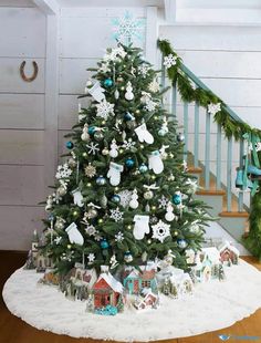 a decorated christmas tree in the corner of a room