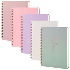 five notebooks lined up next to each other