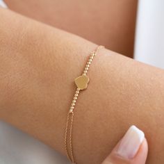 "Gold Heart Bracelet, Tiny Heart Bracelet, 14k Solid Gold Bracelet, Bridesmaid Gift, Wedding Gift, Anniversary Gift, Christmas gift For Her its presence will make a difference on your wrist with its special design. It is suitable for daily use as well as for special occasions. More details; Gold heart bracelet weighs 3.62 gr and the chain length is 17 cm. There may be +/- 0.15 change in gram information due to production. Your products will be shipped with free shipping UPS express within 1-3 bu Tiny Heart Bracelet, Heart Bracelet Gold, Gold Heart Bracelet, Evil Eye Necklace Gold, Solid Gold Bracelet, Bracelet Heart, Bracelet Minimalist, Bracelet Love, Gold Armband