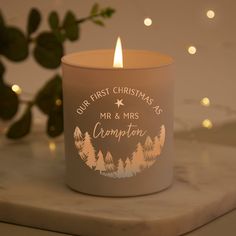 a candle with the words our first christmas is mr and mrs crumpton on it