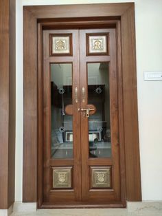 two wooden doors with glass on each side