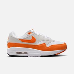 Style No. DZ2628-002 Color: Neutral Grey/White/Black/Safety Orange Meet the leader of the pack. Walking on clouds above the noise, the Air Max 1 blends timeless design with cushioned comfort. Sporting a fast-paced look, wavy mudguard and Nike Air, this classic icon hit the scene in ‘87 and continues to be the soul of the franchise today. Nike Air Max 1 Women's Shoes. Leader Of The Pack, Classic Icon, Red Puffer, Streetwear Shoes, On Clouds, Walking On Clouds, Air Max Women, Fast Paced, Air Max 1