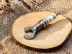 a wrench sitting on top of a piece of wood