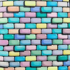 a colorful brick wall with lots of different colors